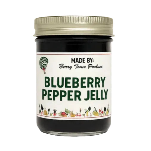Jar of blueberry pepper jelly with a white label on a white background